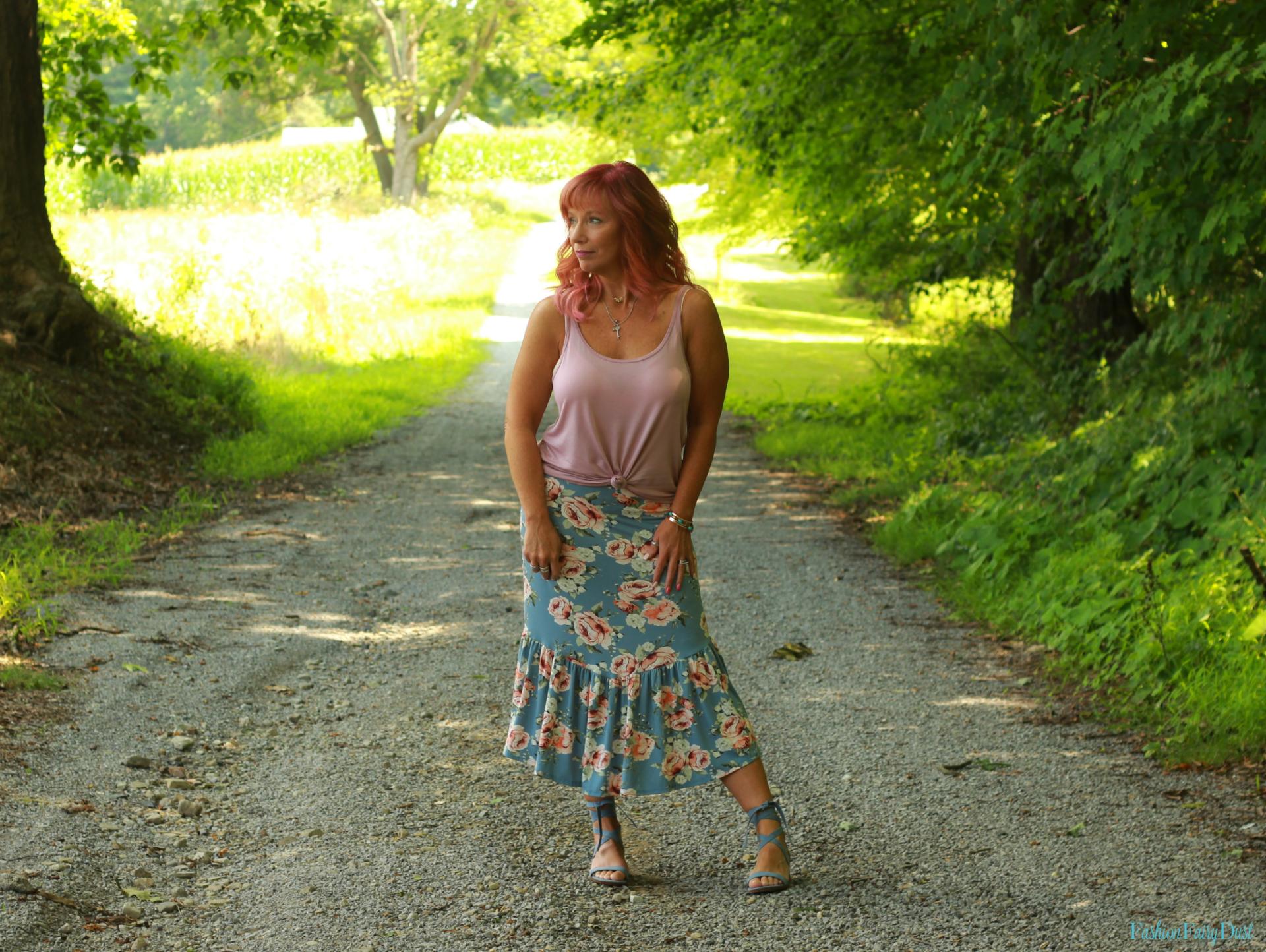 Ruffled skirt, lace up sandals and tank top.