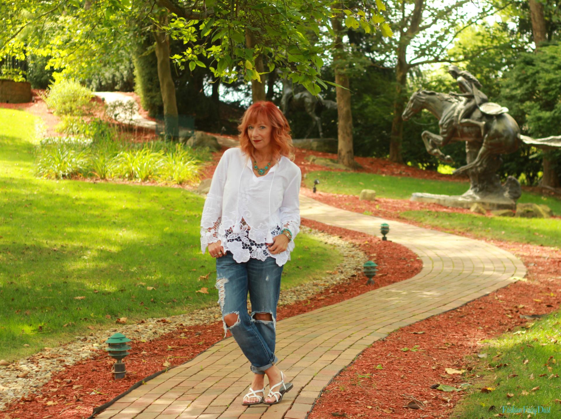 White peasant top, boyfriend jeans and white sandals.