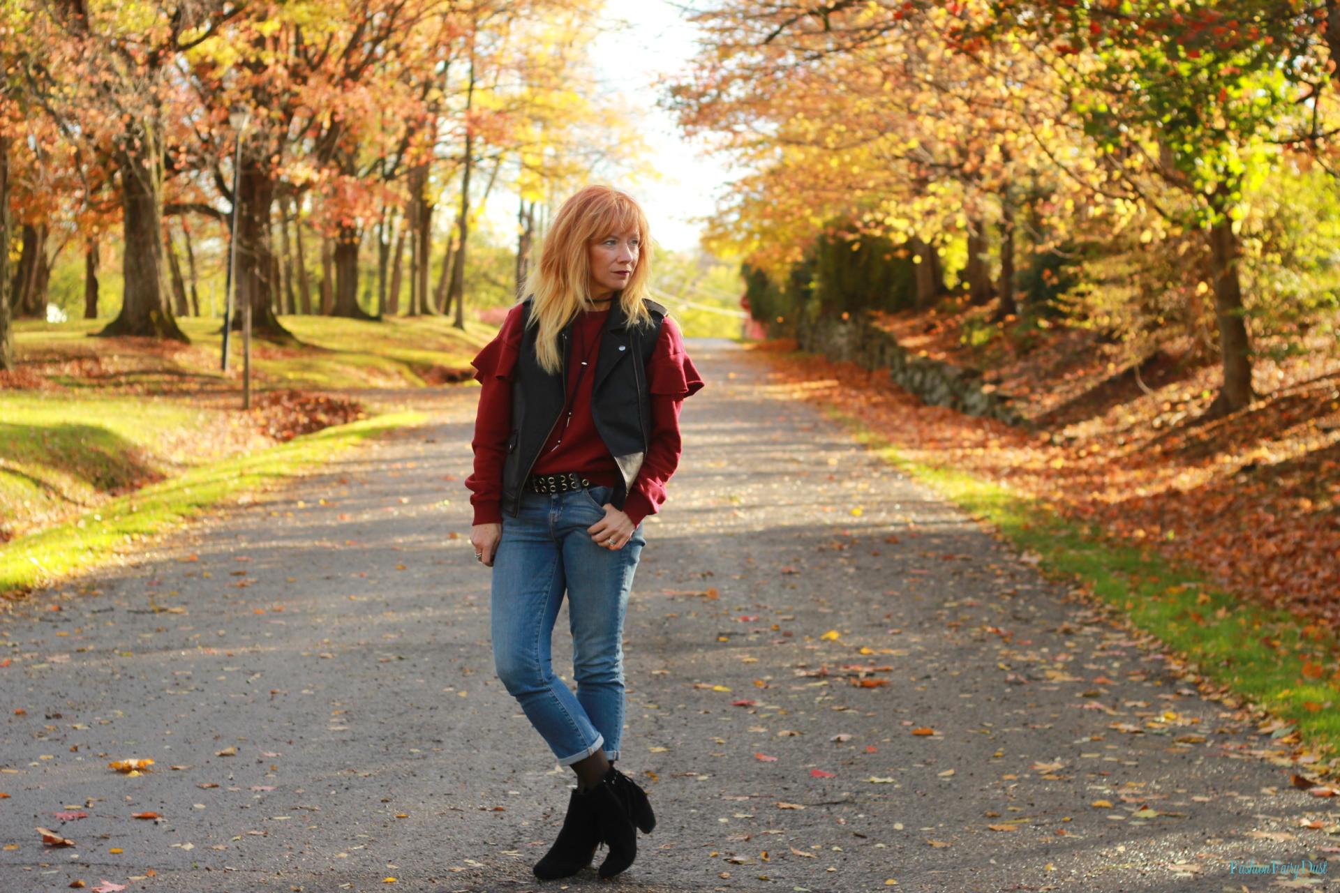 Ruffle sleeve sweatshirt, moto vest and cropped skinny jeans.