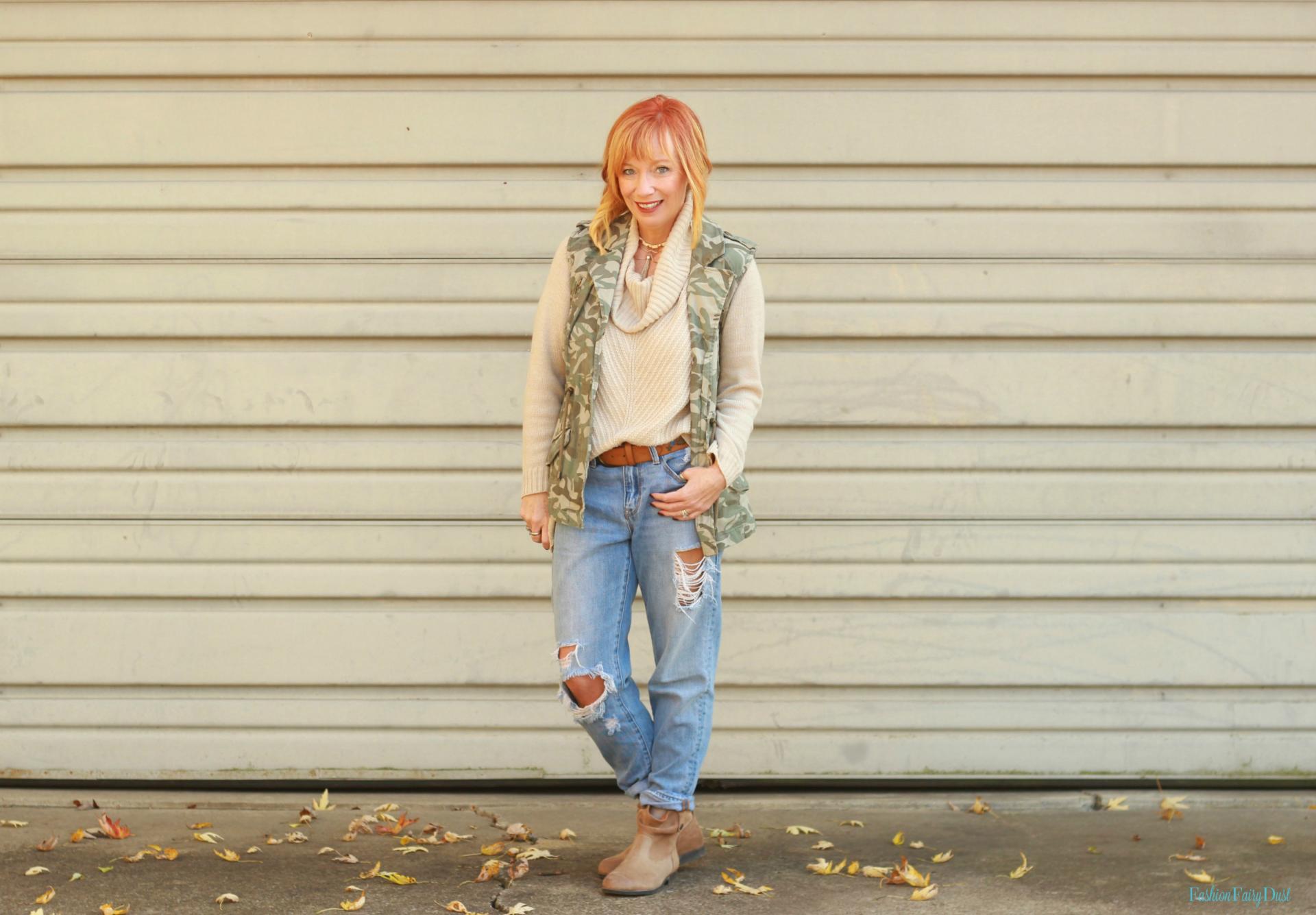 Cowl neck sweater, Birkenstock boots and camo vest.