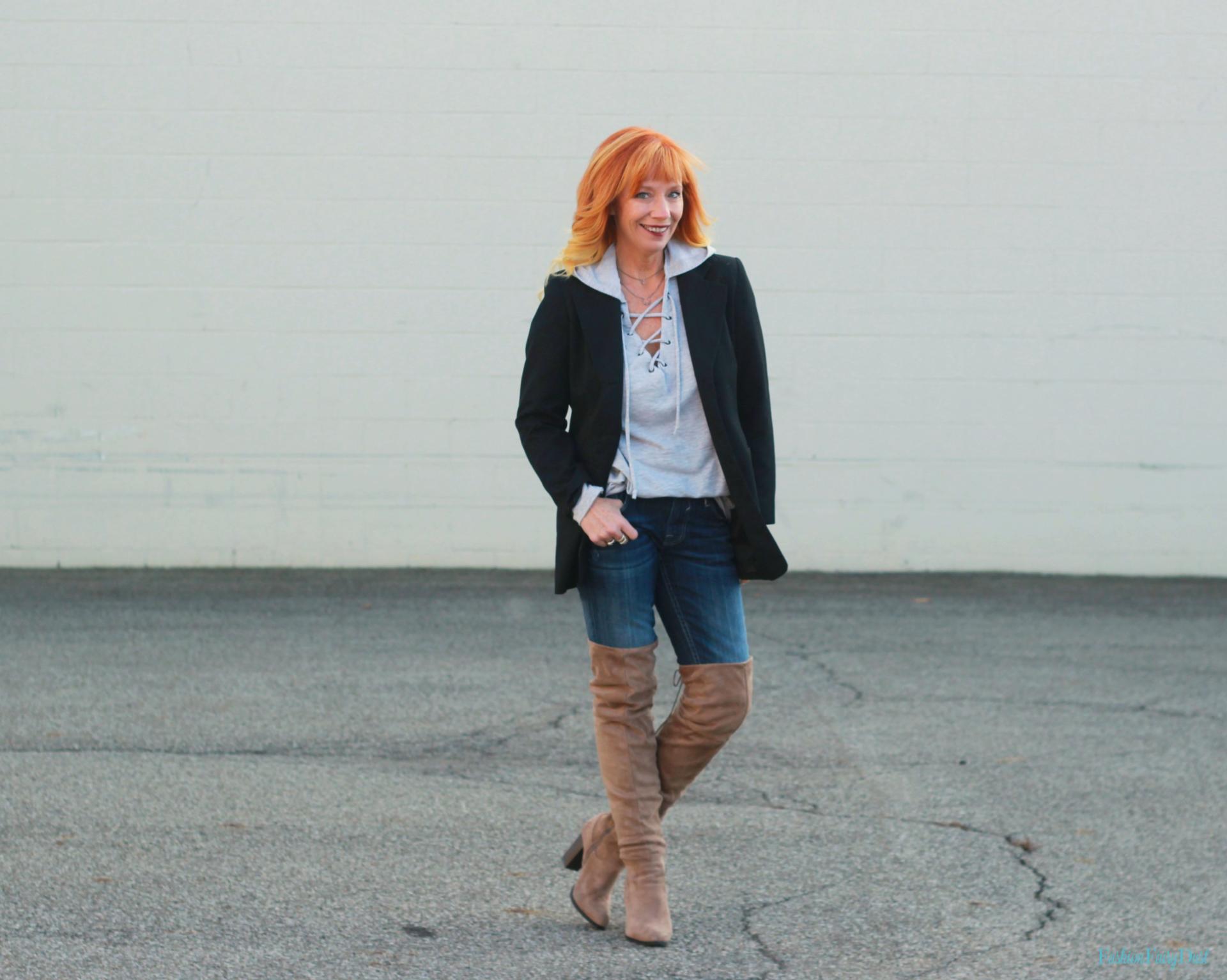 Black blazer, hoodie and over the knee boots.