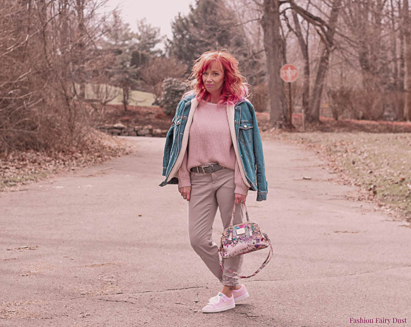 Gray pants, blush off the shoulder sweater and pink Pumas.