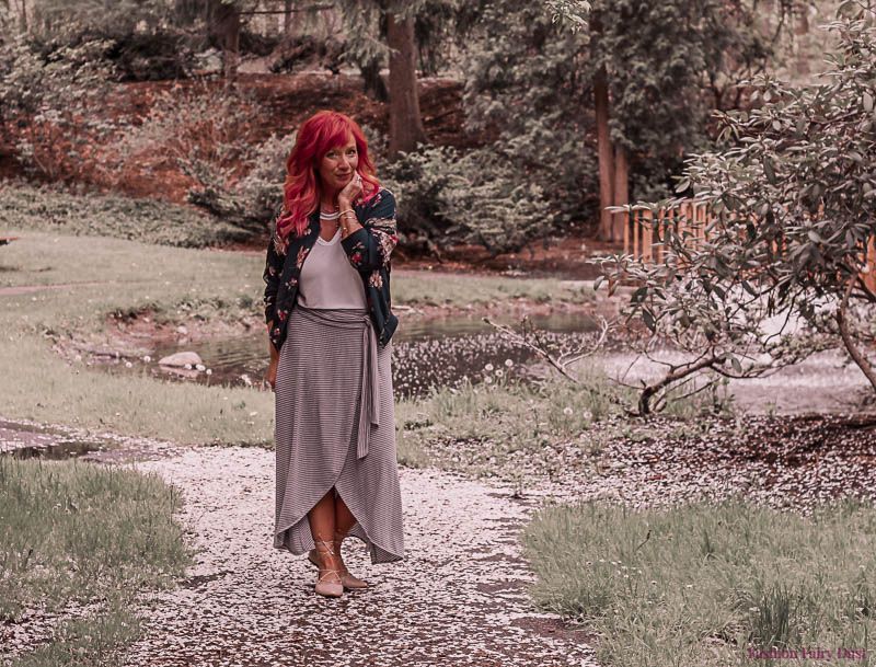 Striped wrap skirt, lace up flats and floral bomber jacket.